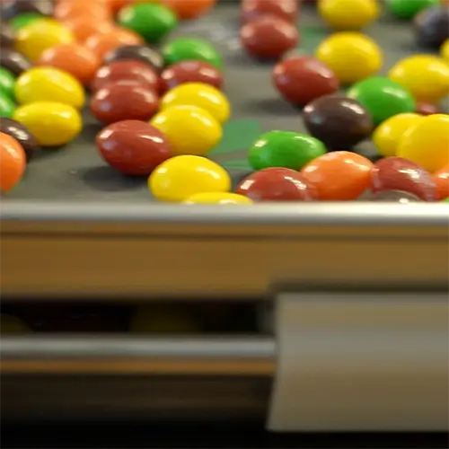 A medium harvest right freeze drying tray covered in Skittles ready to go into the freeze dryer.