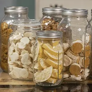 A collection of several mason jars filled with freeze dried lemons, bananas, chili, taco soup, and strawberry lime pie bites.