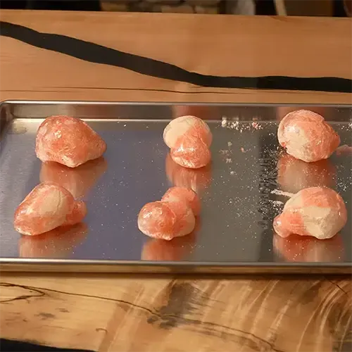 Six different shaped Haribo Peaches placed neatly on a freeze dry tray.
